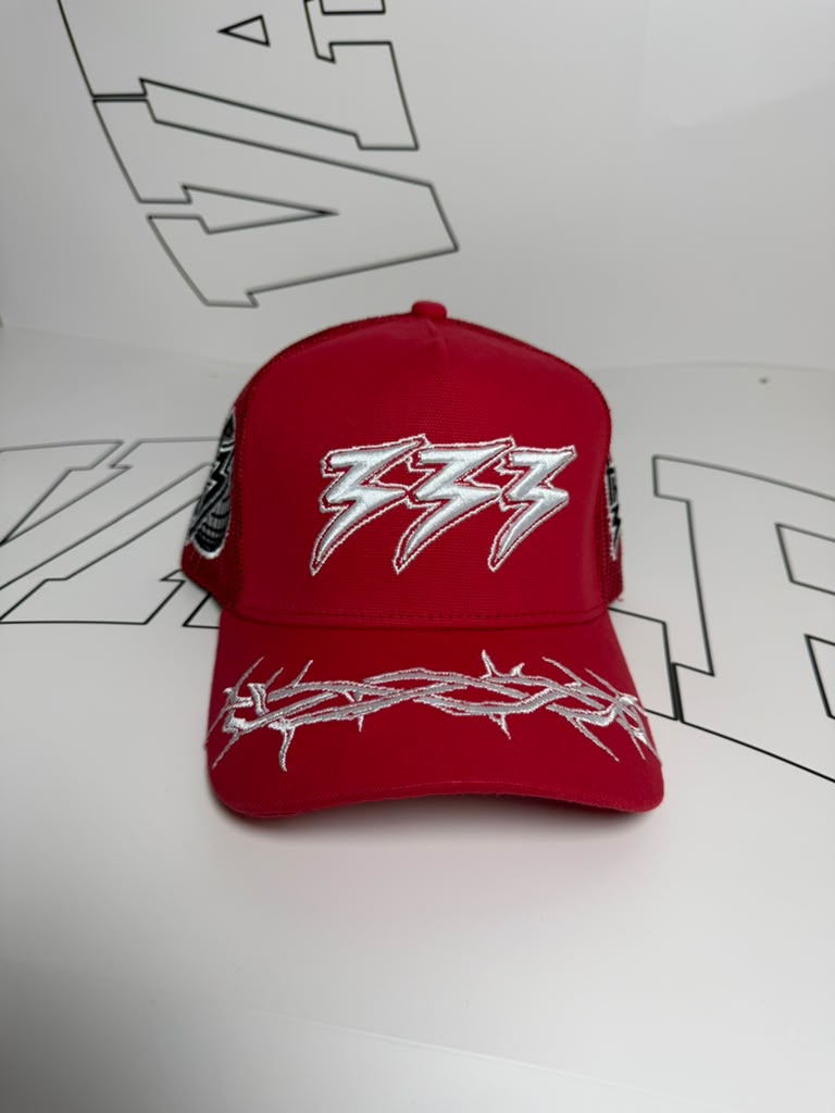 Red cap with white logo on a white background